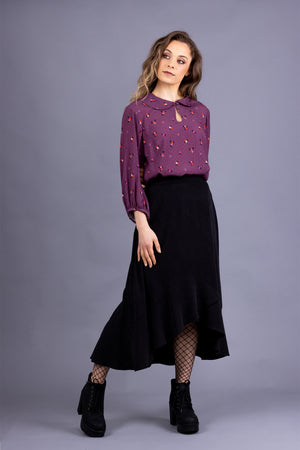 Rosalie darted midi skirt in black tencel twill, with Helmi peter pan collar blouse in magenta viscose, front view