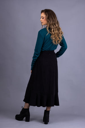 Rosalie darted midi skirt in black tencel twill, with turquoise rib knit top, back view
